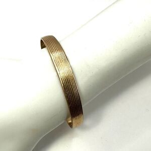 Small gold tone bangle bracelet